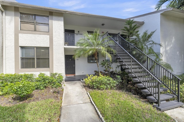 1256 S Military Trl Unit 915, Deerfield Beach, FL 33442 - view of building exterior with stairway