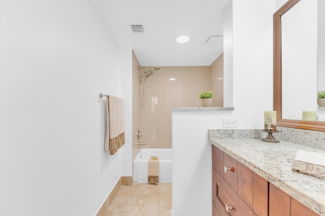 bathroom featuring vanity and tiled shower / bath combo