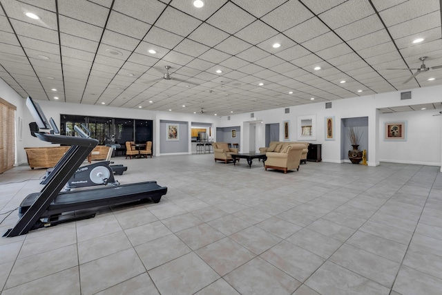 exercise area featuring a paneled ceiling