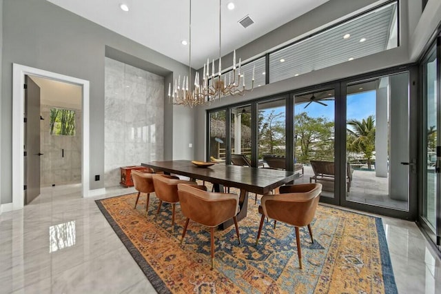 dining area with marble finish floor, recessed lighting, visible vents, and an inviting chandelier