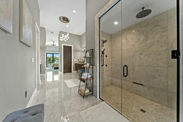 bathroom featuring a stall shower, marble finish floor, visible vents, and baseboards