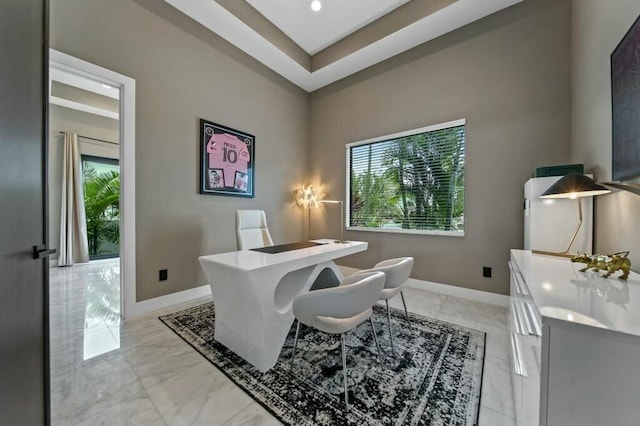 office area featuring marble finish floor and baseboards