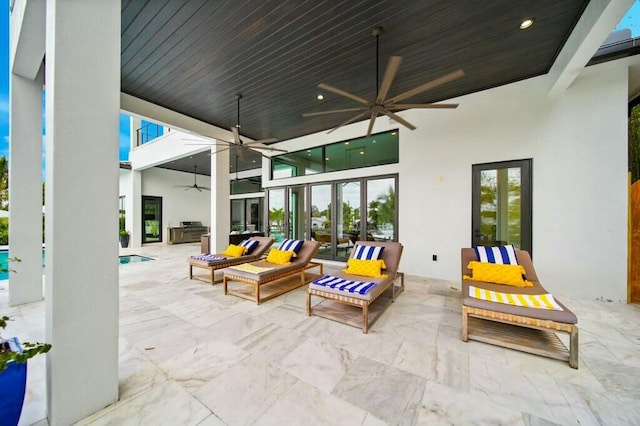 view of patio with a ceiling fan, outdoor lounge area, and an outdoor pool