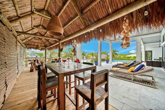 view of patio with a gazebo and outdoor dining space