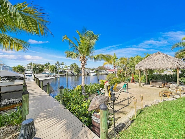 dock area featuring a patio area, a gazebo, and a water view