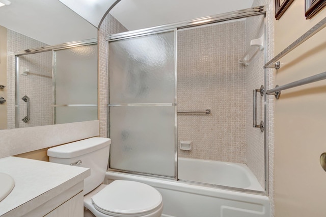 full bathroom with toilet, vanity, and shower / bath combination with glass door