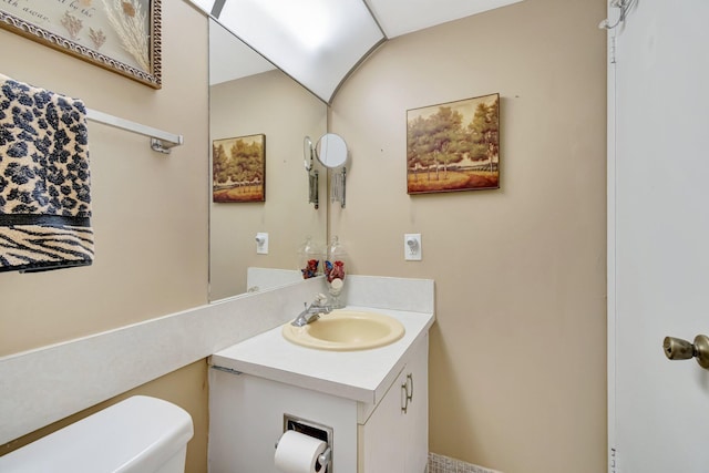 bathroom with toilet and vanity