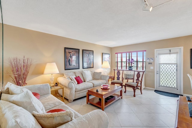 tiled living room with a textured ceiling