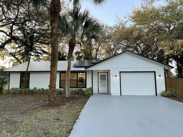 ranch-style house featuring a garage