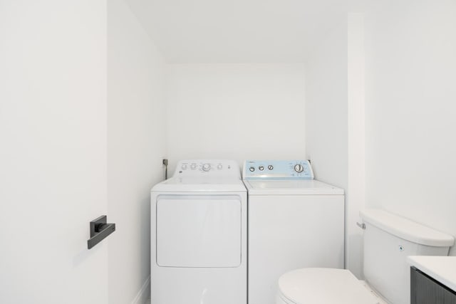 clothes washing area with laundry area and separate washer and dryer