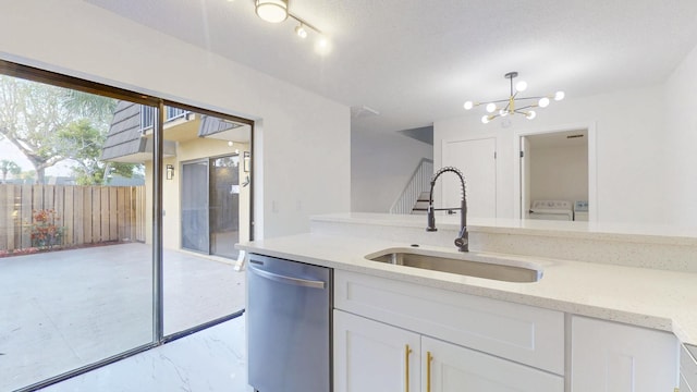 kitchen featuring a sink, white cabinetry, marble finish floor, light stone countertops, and dishwasher