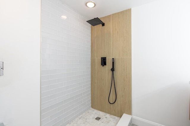 full bathroom with tiled shower