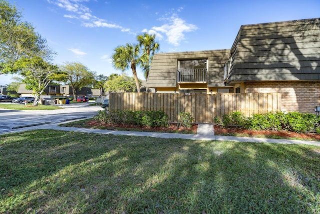 view of yard featuring a residential view and fence