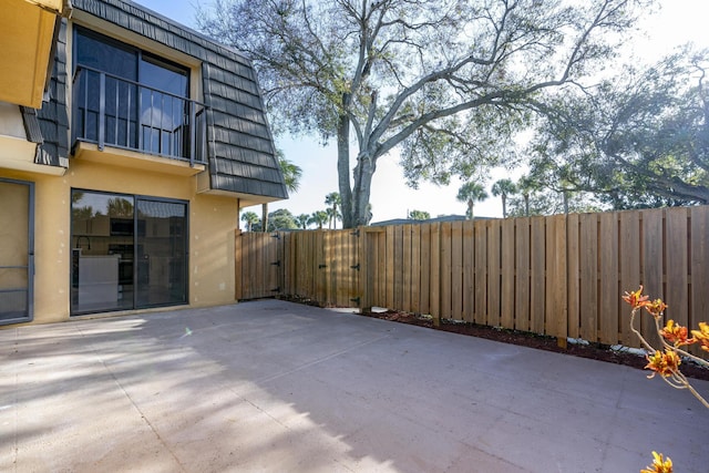 view of patio / terrace with fence and a gate