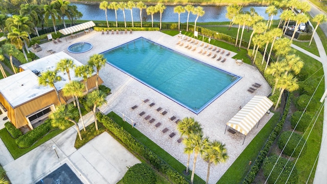 birds eye view of property with a water view