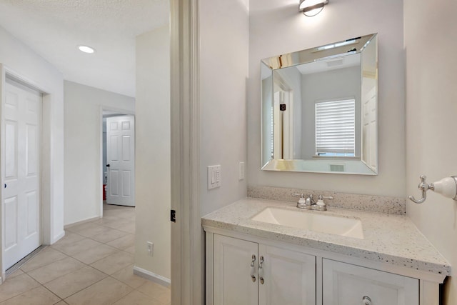 bathroom featuring vanity and tile patterned flooring