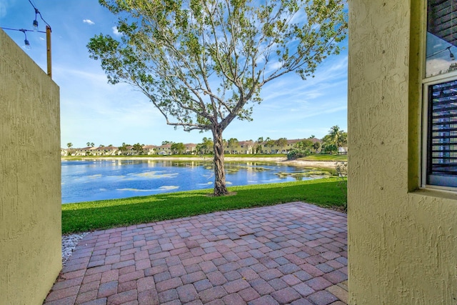 view of patio / terrace featuring a water view