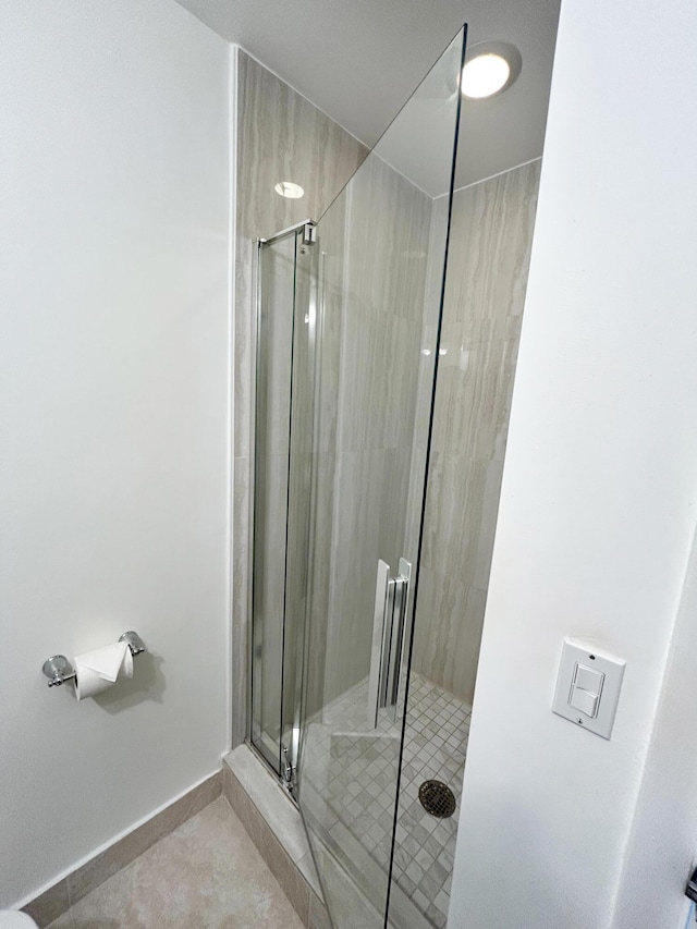 bathroom with a shower with shower door