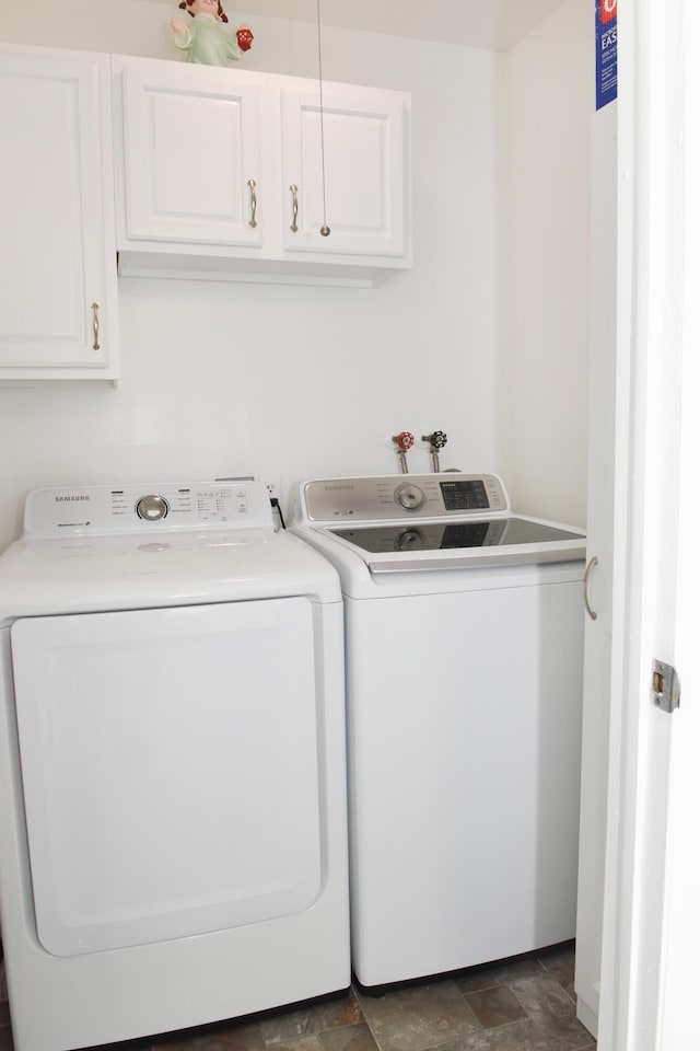 laundry area with cabinets and washer and dryer