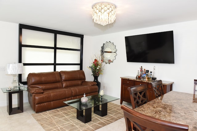 living room featuring an inviting chandelier and light tile patterned floors