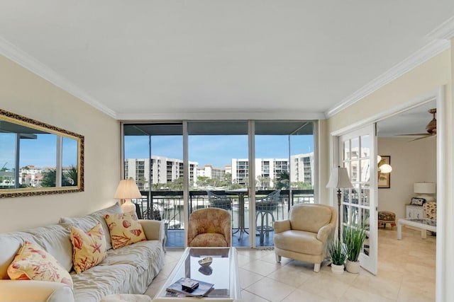 tiled living room with a water view, ceiling fan, floor to ceiling windows, and crown molding