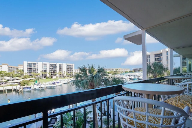 balcony featuring a water view