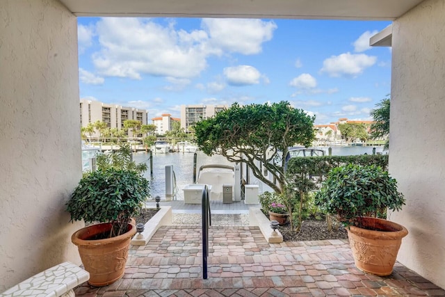 balcony with a water view and a patio area