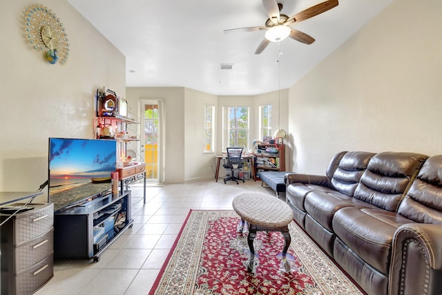 living room featuring light tile patterned floors, ceiling fan, and visible vents