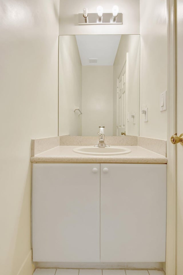 bathroom featuring tile patterned flooring, visible vents, and vanity