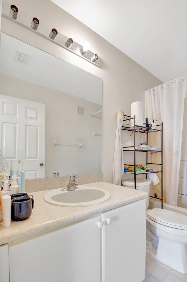 full bathroom with visible vents, toilet, shower / tub combo with curtain, tile patterned floors, and vanity
