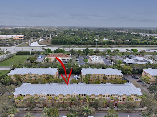 birds eye view of property with a residential view