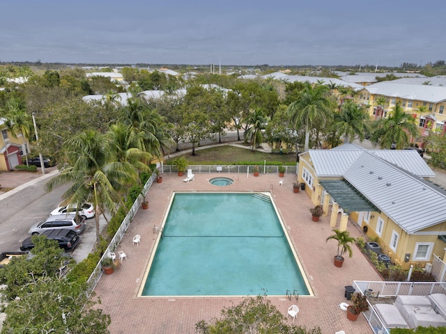 view of pool featuring a residential view, a patio area, and fence