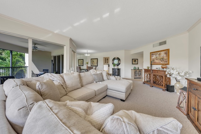 living room featuring crown molding and light colored carpet