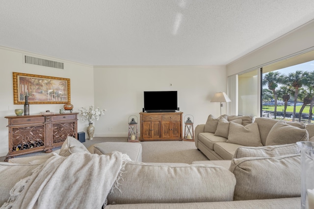 living room with ornamental molding, light carpet, and a textured ceiling