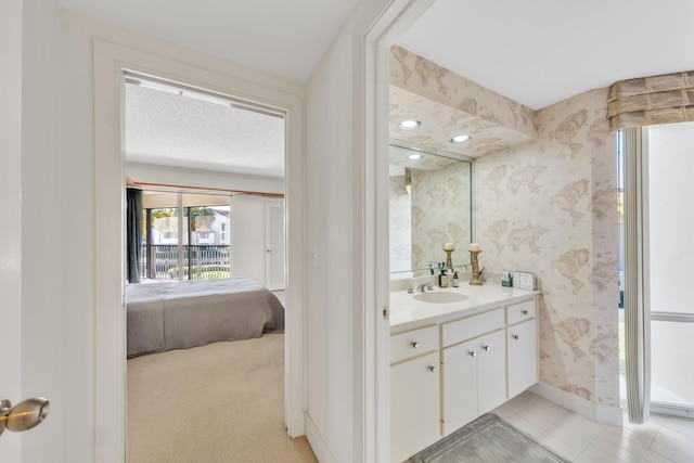 bathroom featuring vanity and a textured ceiling