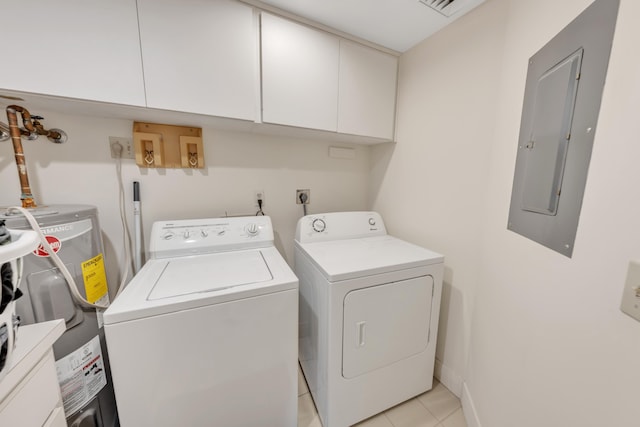 clothes washing area with light tile patterned floors, water heater, electric panel, cabinets, and washing machine and dryer