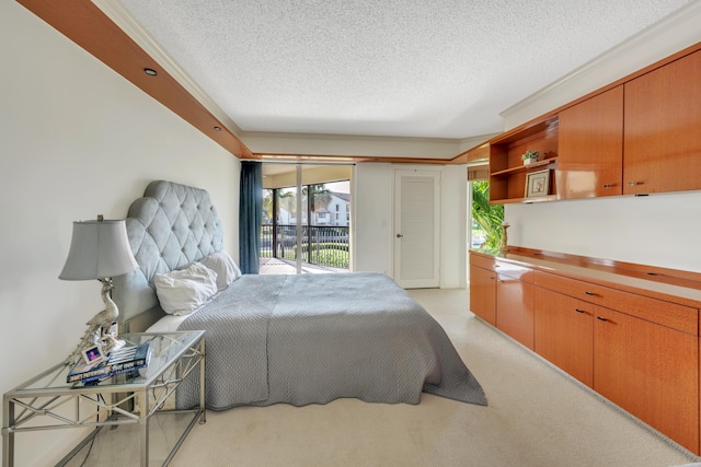 carpeted bedroom featuring a textured ceiling