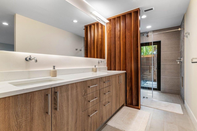 bathroom with vanity and tile patterned flooring