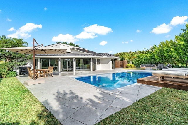 view of pool featuring a patio area