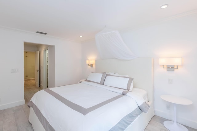 bedroom featuring ornamental molding, recessed lighting, visible vents, and baseboards