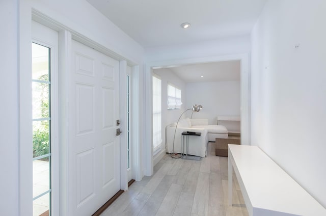 foyer featuring light wood finished floors and recessed lighting