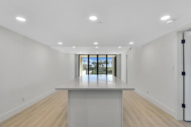 kitchen featuring a kitchen island and light wood-type flooring