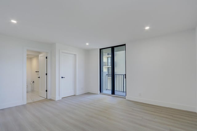 unfurnished room featuring light hardwood / wood-style flooring