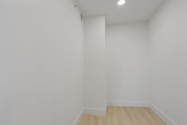 spare room with light hardwood / wood-style flooring