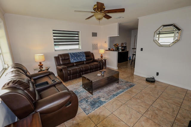 tiled living room featuring crown molding, a wealth of natural light, and ceiling fan