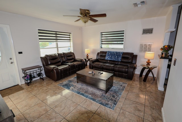 living room featuring light tile patterned flooring and ceiling fan