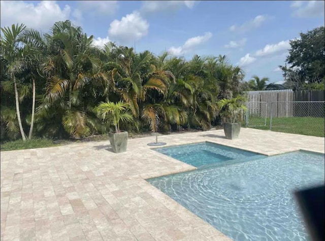 view of pool with a patio area