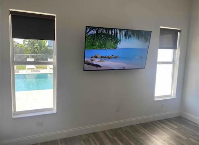 unfurnished room featuring hardwood / wood-style floors