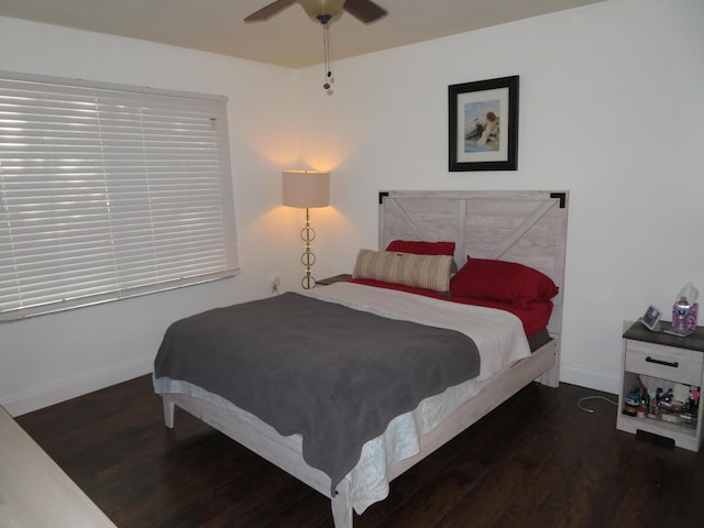 bedroom featuring dark wood-style floors, ceiling fan, and baseboards