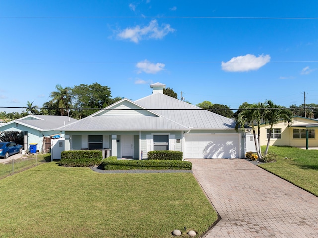 ranch-style home with a front yard and a garage